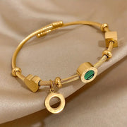Golden Bracelet with a Green Gemstone