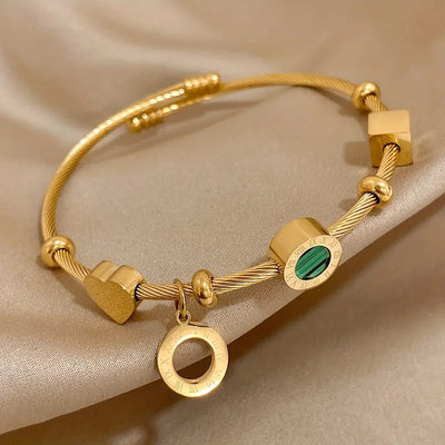 Golden Bracelet with a Green Gemstone