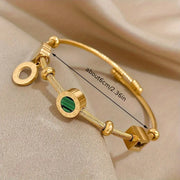 Golden Bracelet with a Green Gemstone